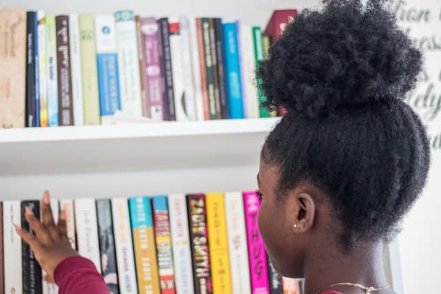 girl browsing through books